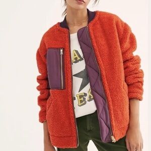 We The Free Women's Bomber Jacket in reddish orange with purple accents
